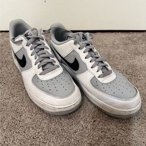 Gray and white Nike Air Force 1s